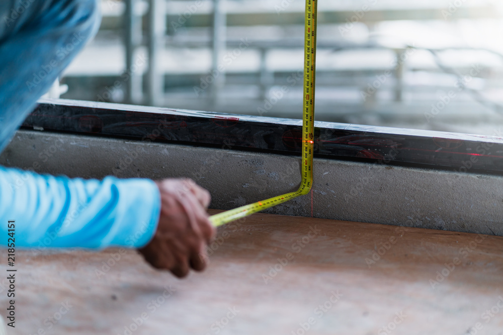 worker is measure tape construction site concept