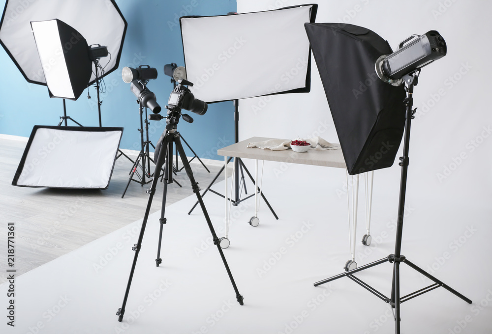 Interior of modern photo studio with professional equipment