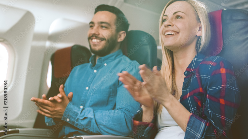 On Board of Commercial Airplane Beautiful Young Blonde and Handsome Hispanic Male Applauding Pilots