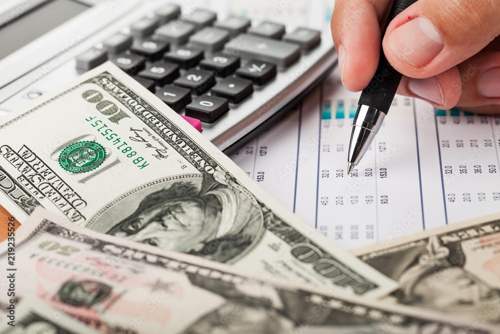 Close-up of a Businessman Analyzing Financial Figures with