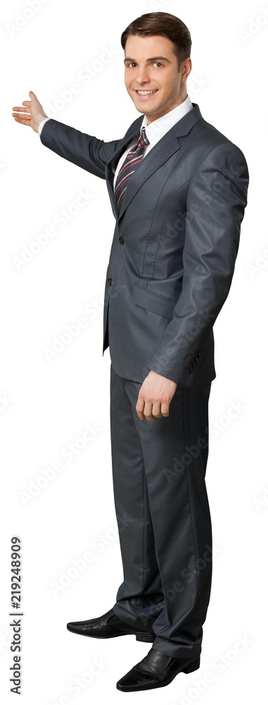 Friendly Businessman Standing and Pointing Using Palm - Isolated