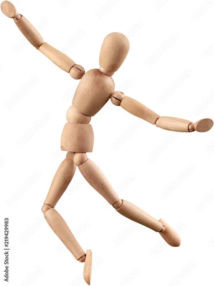 Miniature wooden mannequin dancing