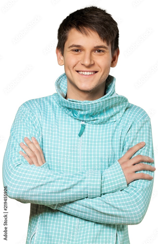 Young man wearing a turtleneck sweater with his arms crossed