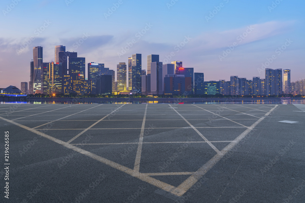 Urban road asphalt pavement and skyline of Hangzhou architectural landscape