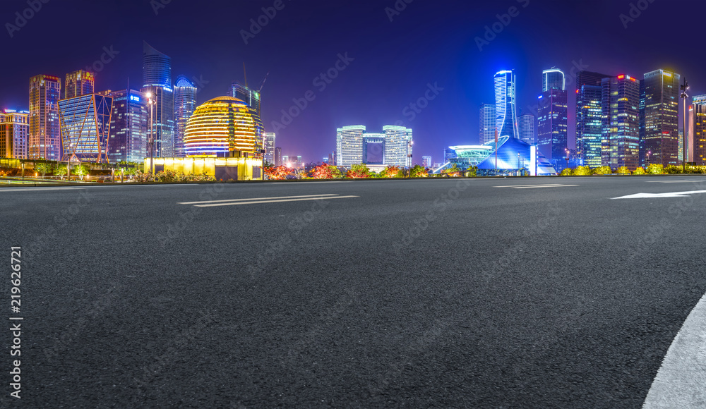 Urban road asphalt pavement and skyline of Hangzhou architectural landscape