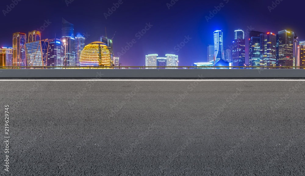 Urban road asphalt pavement and skyline of Hangzhou architectural landscape