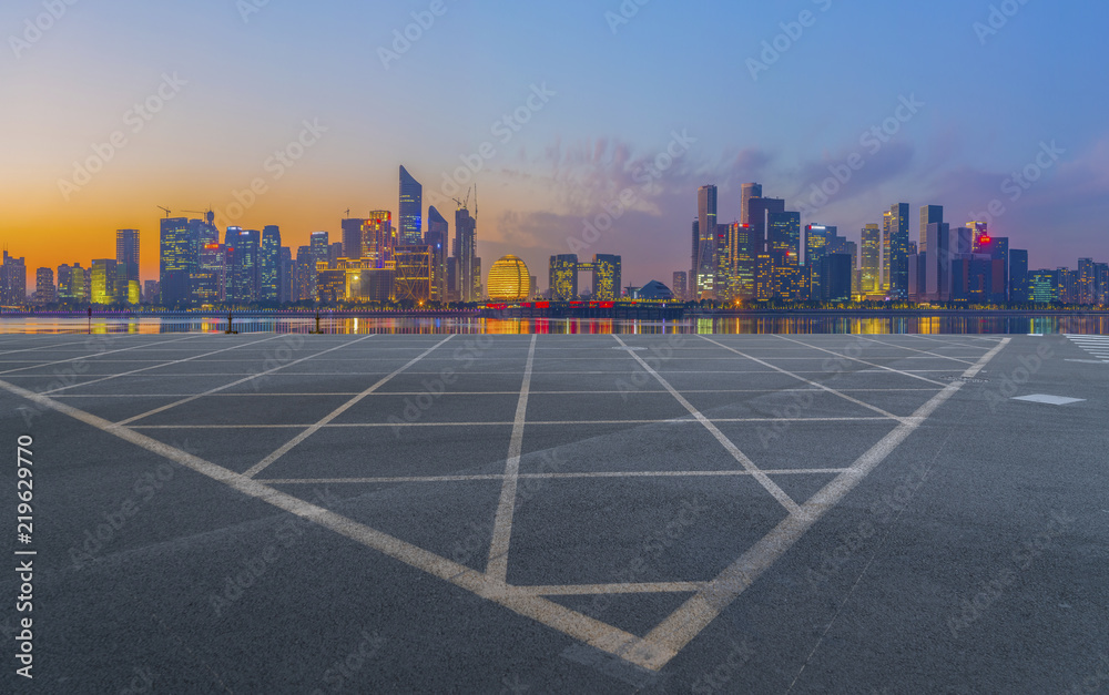 Urban road asphalt pavement and skyline of Hangzhou architectural landscape