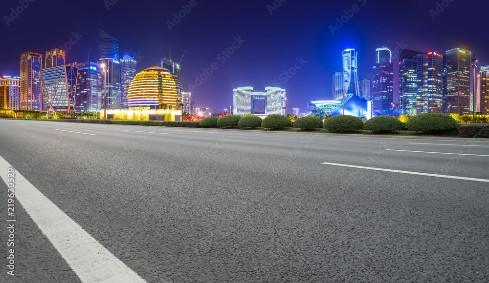 Urban road asphalt pavement and skyline of Hangzhou architectural landscape