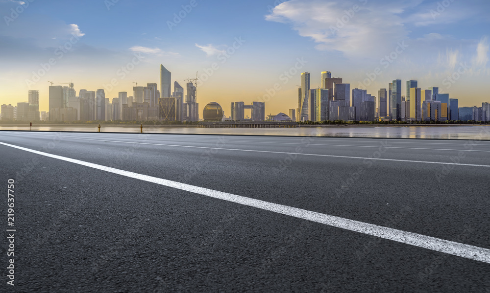 Urban road asphalt pavement and skyline of Hangzhou architectural landscape