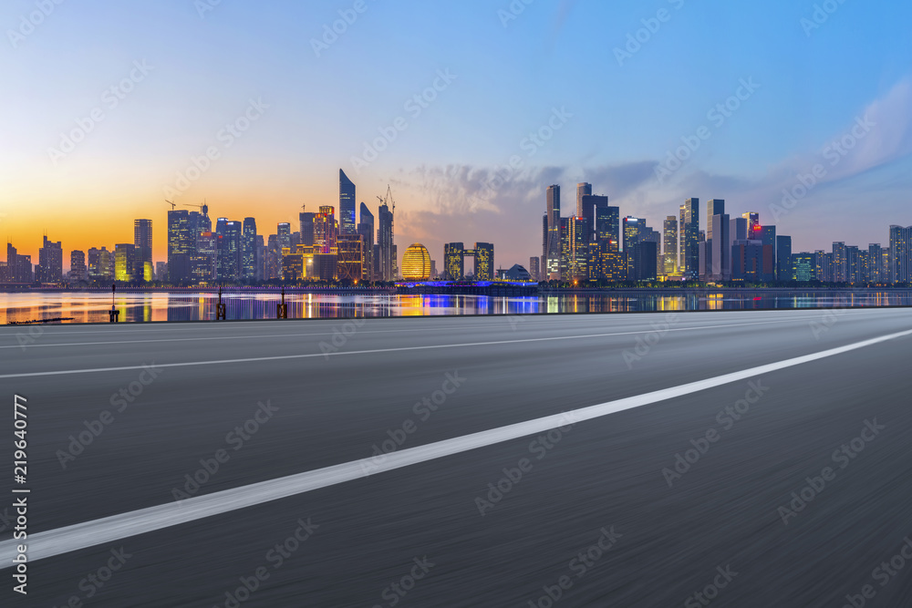 Urban road asphalt pavement and skyline of Hangzhou architectural landscape