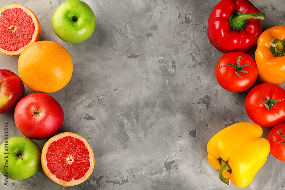 Vegetables and fruits on grey background. Diet food