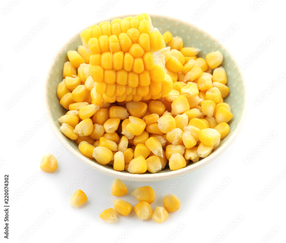 Bowl with tasty corn kernels on white background