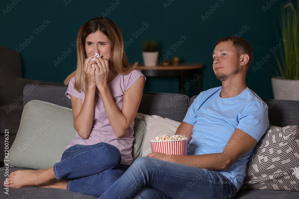 Couple watching soap opera in evening