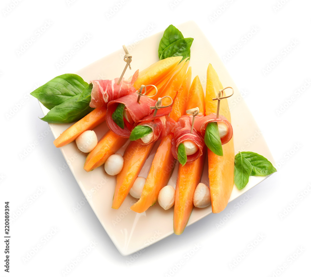 Delicious melon with prosciutto and mozzarella cheese on white background