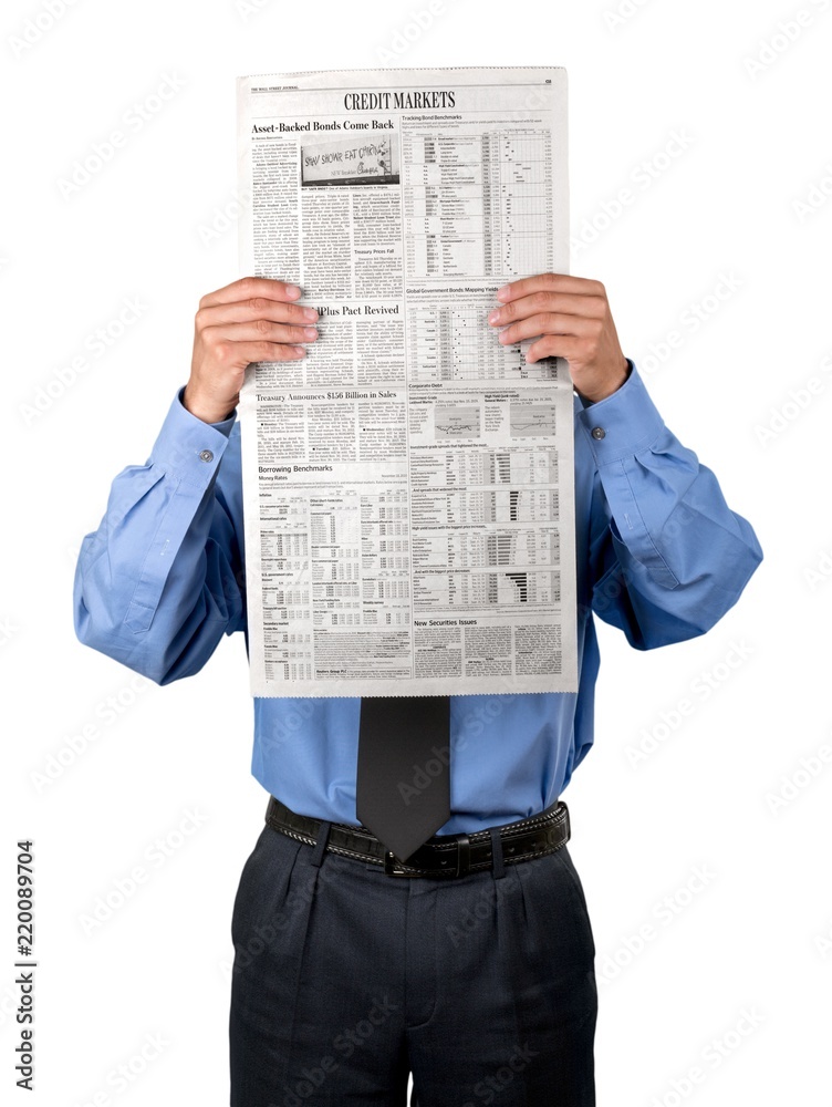 Portrait of a Businessman Holding a Business Newspaper in Front