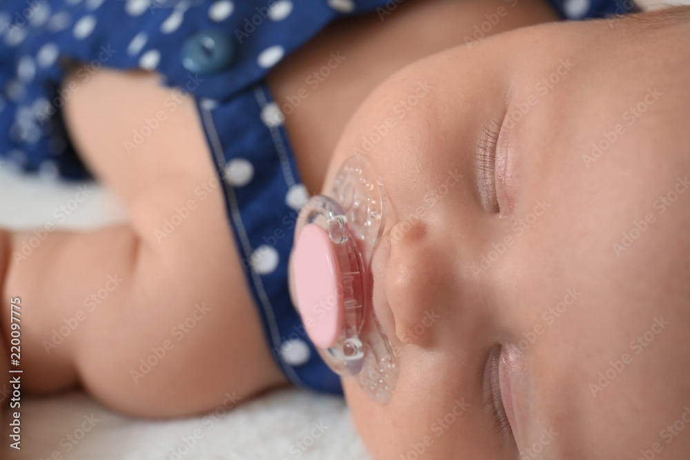 Portrait of cute little baby sleeping on bed, closeup