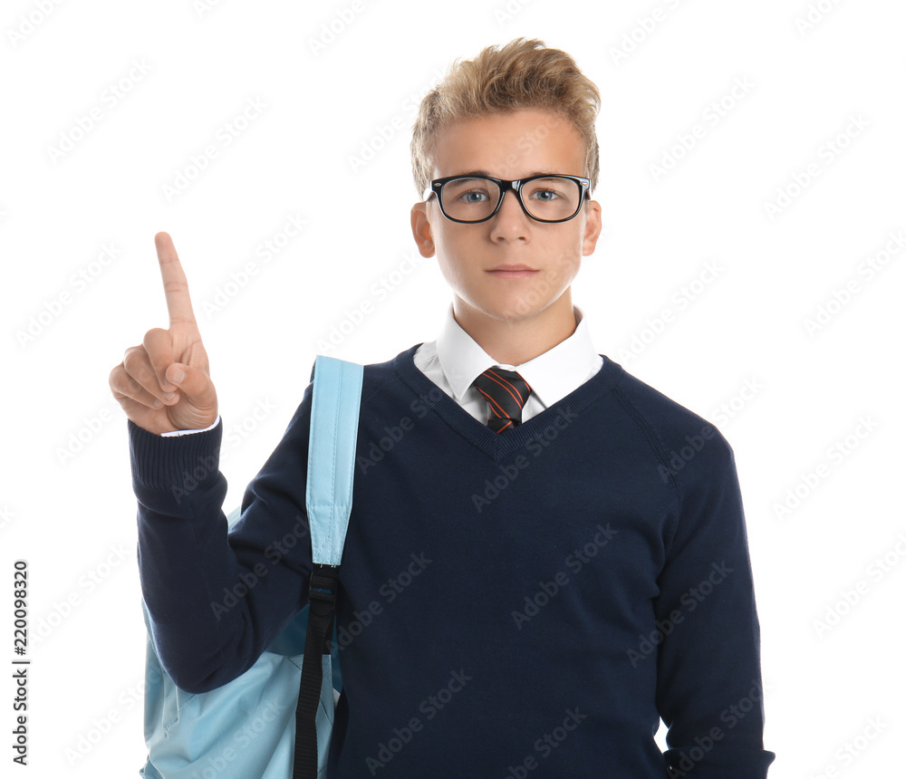 Teenage boy with backpack showing eureka sign on white background