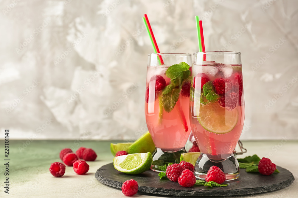 Glasses of fresh raspberry mojito on slate plate