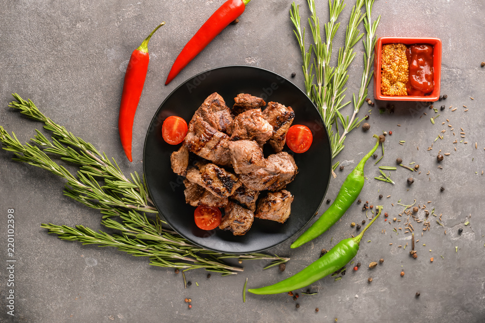 Composition with delicious shish kebab on grey table