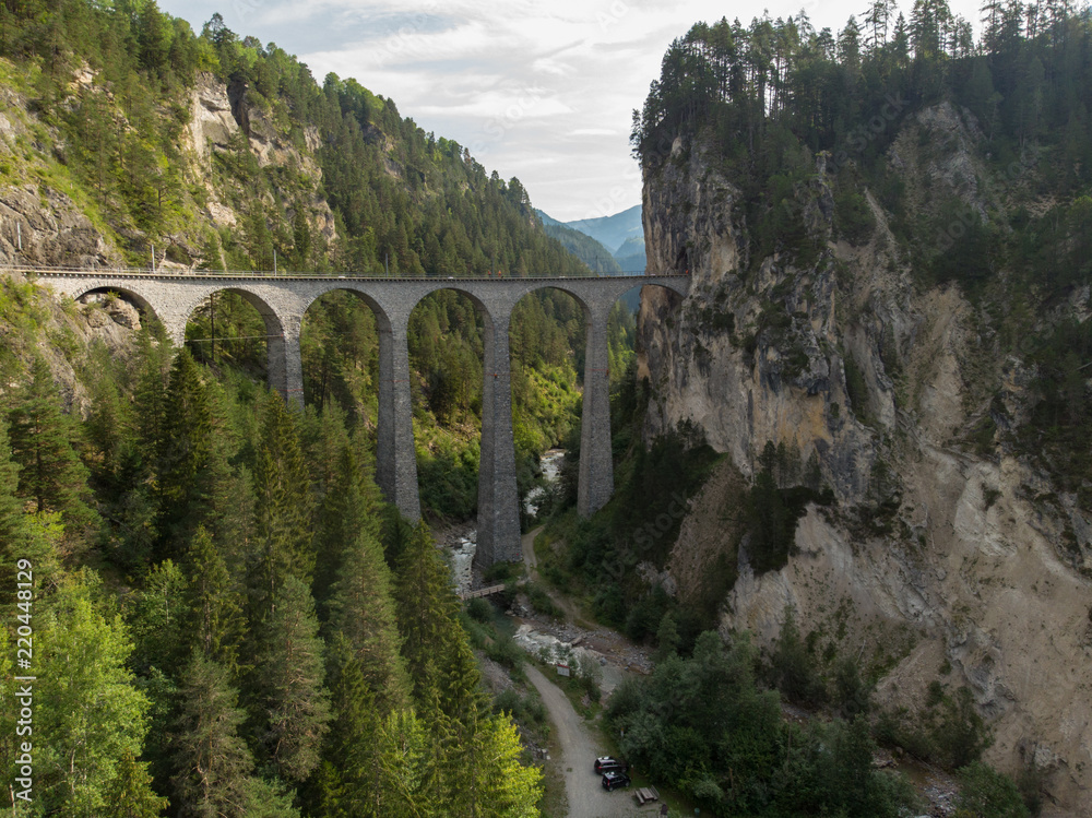 Landwasser Viaduct Switzerland Filisur Graubünden aerial view in Summer with mountains in background