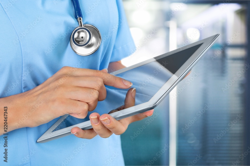 Close-up Doctor at hospital working with tablet pc