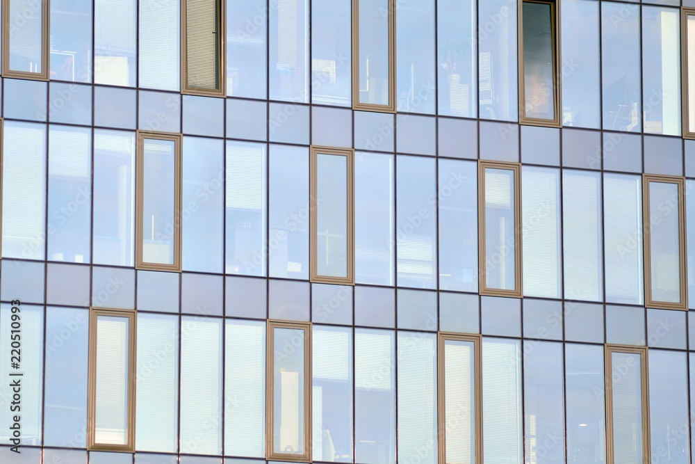 Abstract fragment of contemporary architecture, walls made of glass and concrete. Glass curtain wall