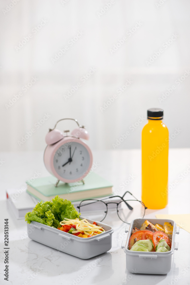 School lunch. Salad, sandwiches, fruits and book