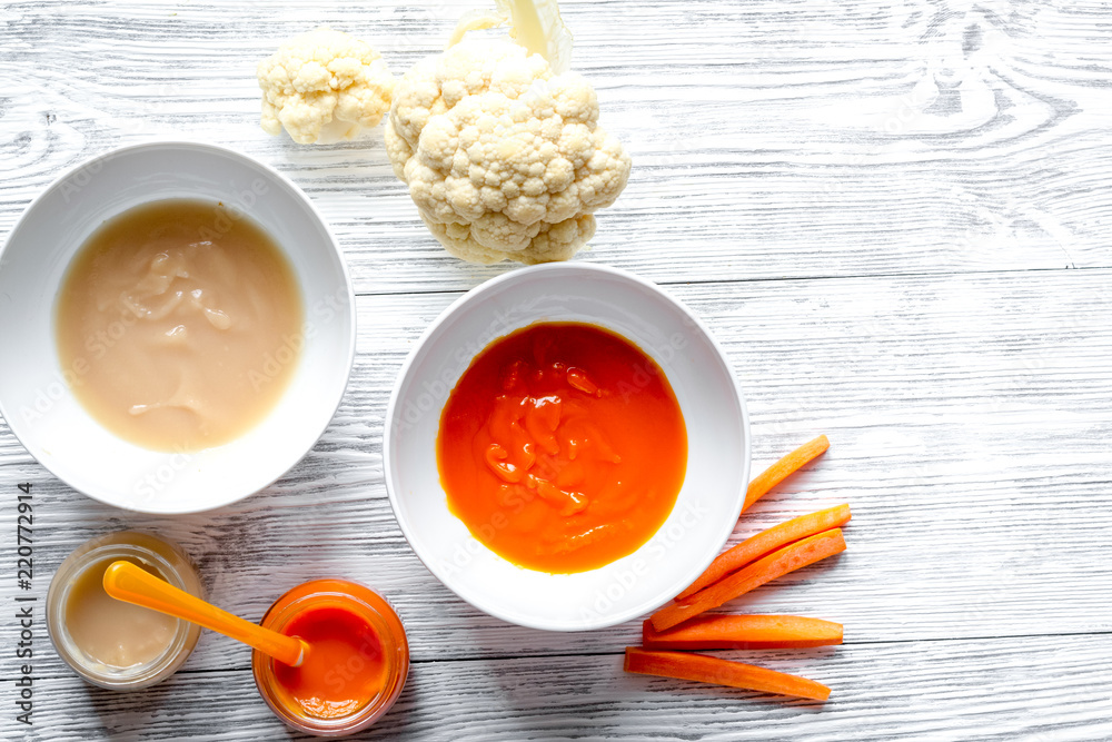 baby vegetable puree on wooden background top view