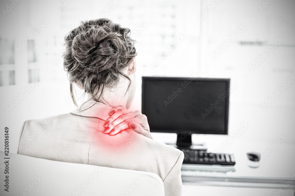 Composite image of rear view of businesswoman with neck pain in