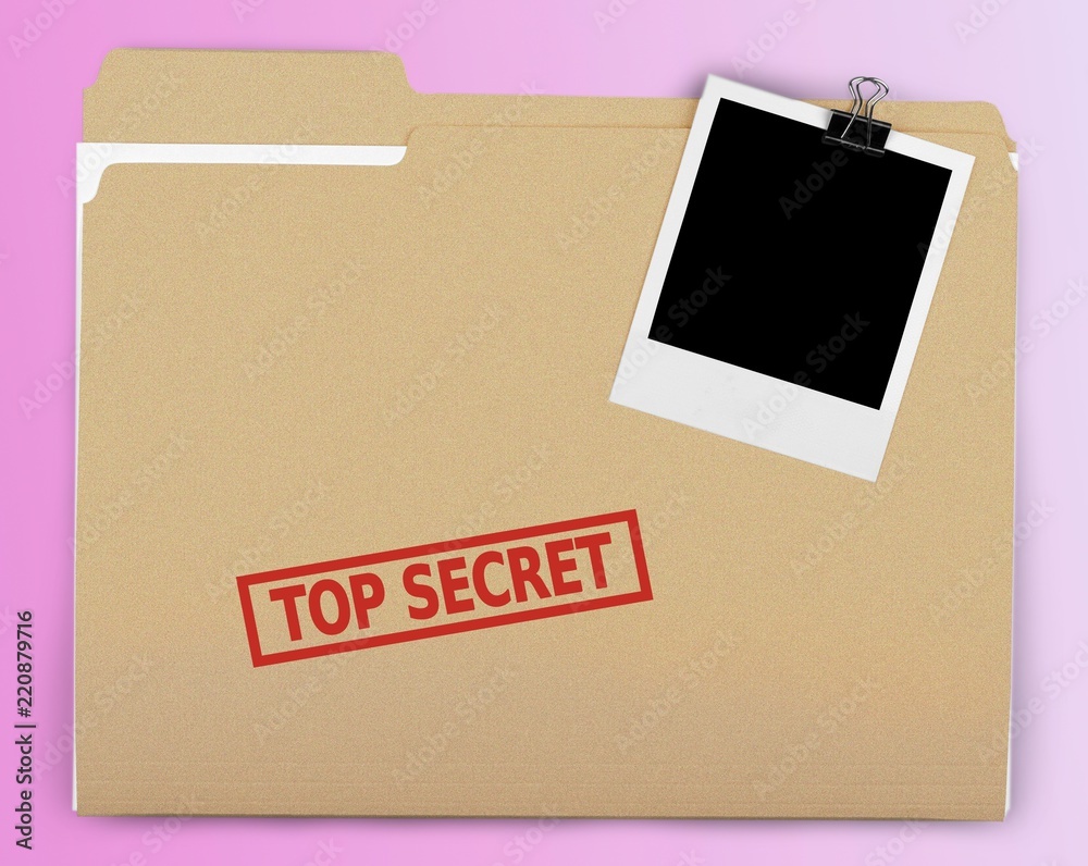 A manila folder with the faded words Top Secret on the front