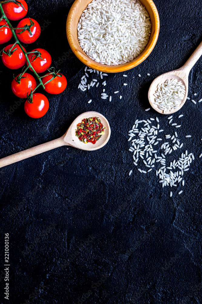 ingredients for paella on dark background top view