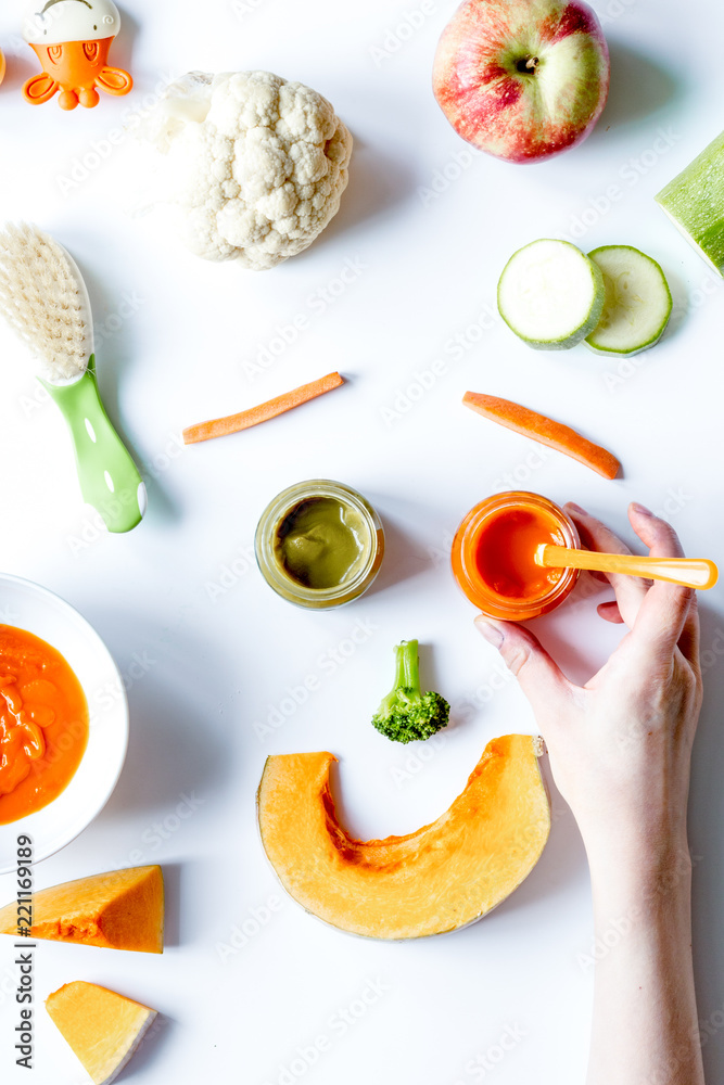 cooking vegetable puree for baby on white background top view