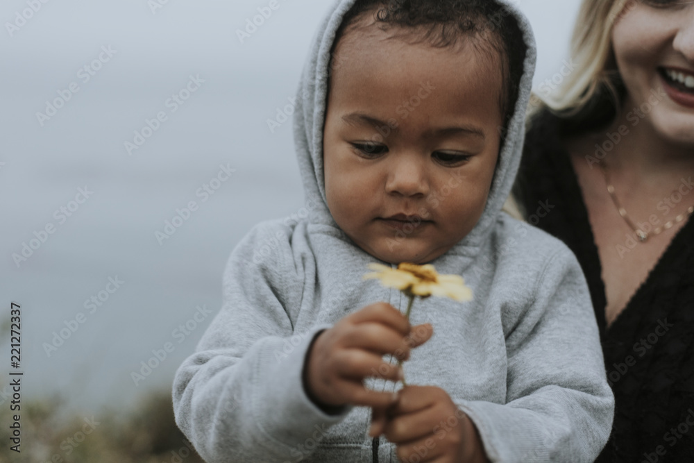 Mom with young son at a beach