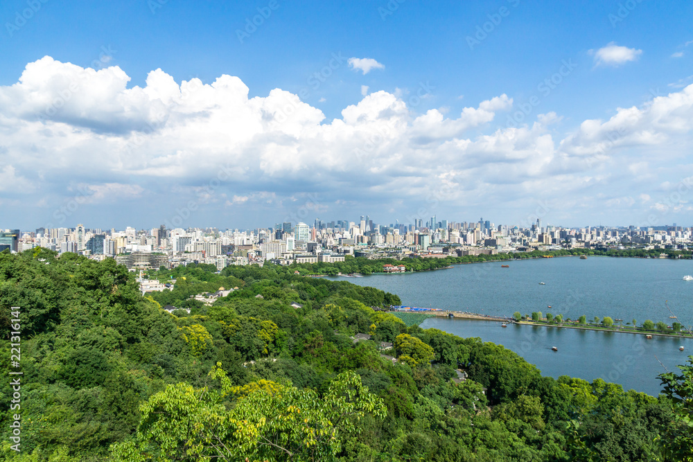 landscape of west lake with hangzhou city skyline