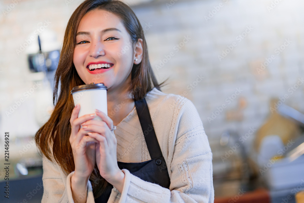 beautiful attractive asian cafe shop owner smile with happiness and joyful with coffee cup apron caf