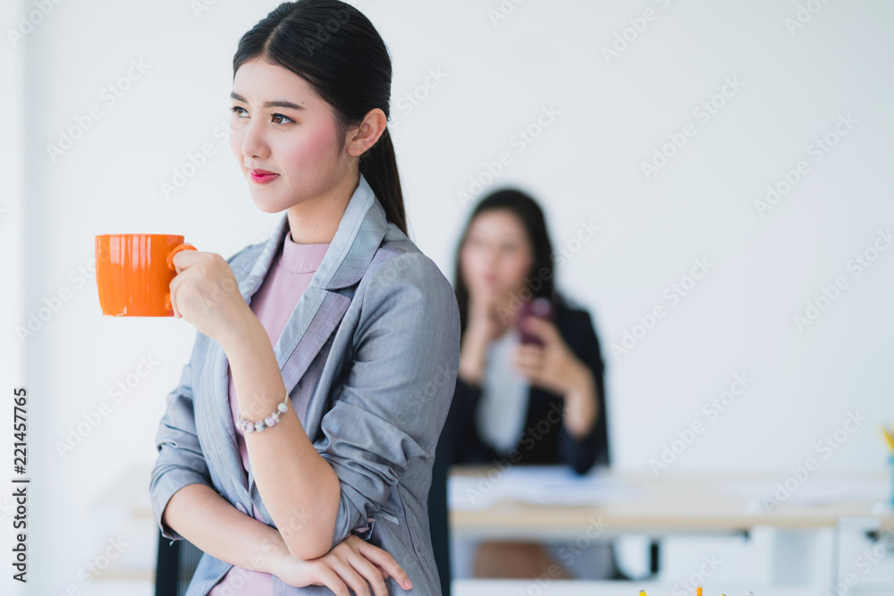 attractive asian woman enjoy morning with hot drink coffee in office with happiness and joyful momen