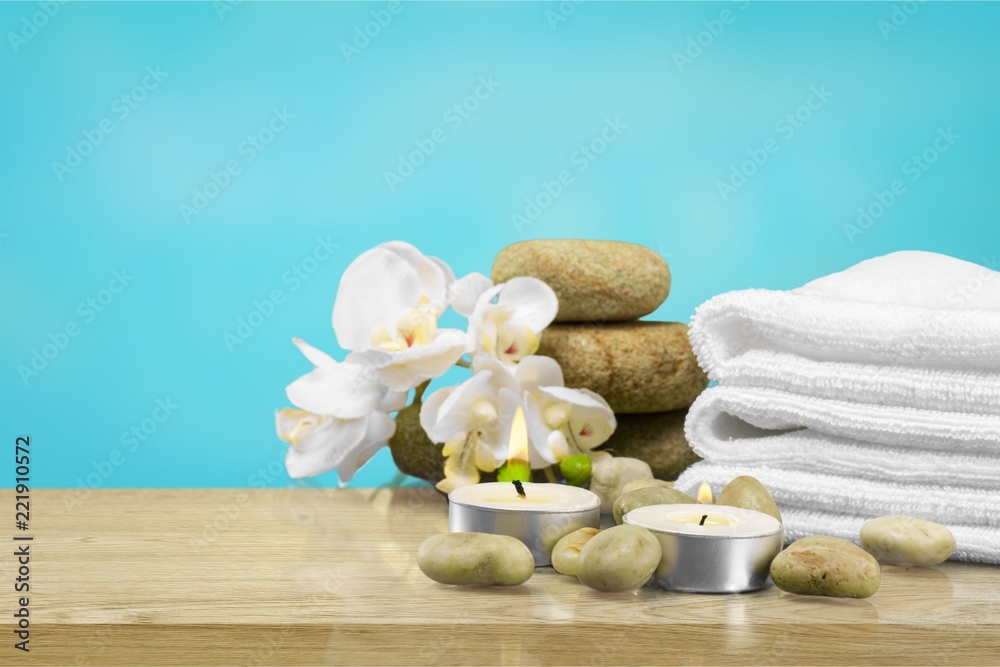 Laundry Basket with colorful towels on background