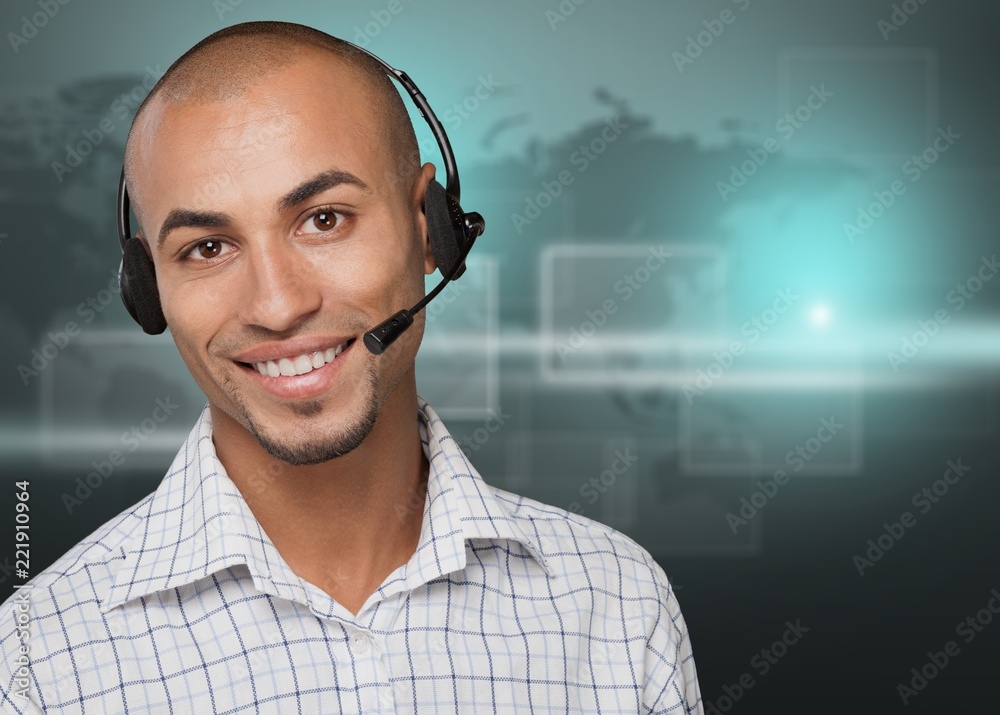 Portrait of a smiling man with headset working as a call center