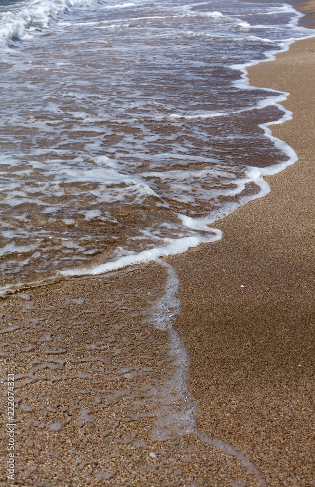 Closeup of Wave of the Sea on a Beach