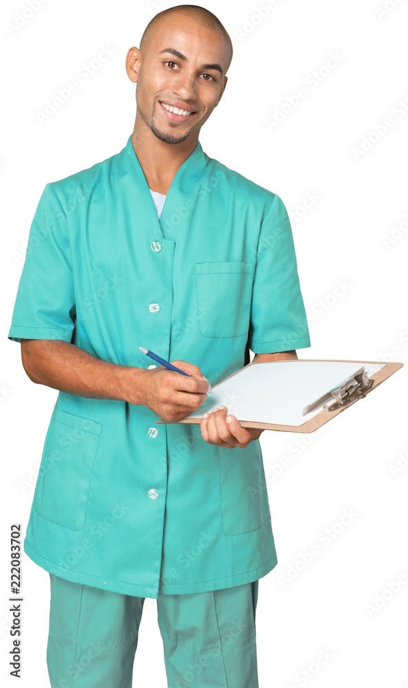 Portrait of a Male Nurse / Doctor Writing on Clipboard