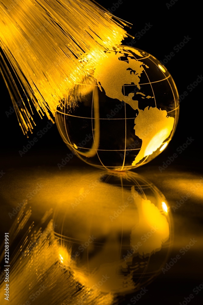 Glass Yellow Globe against Fiber Optic Background