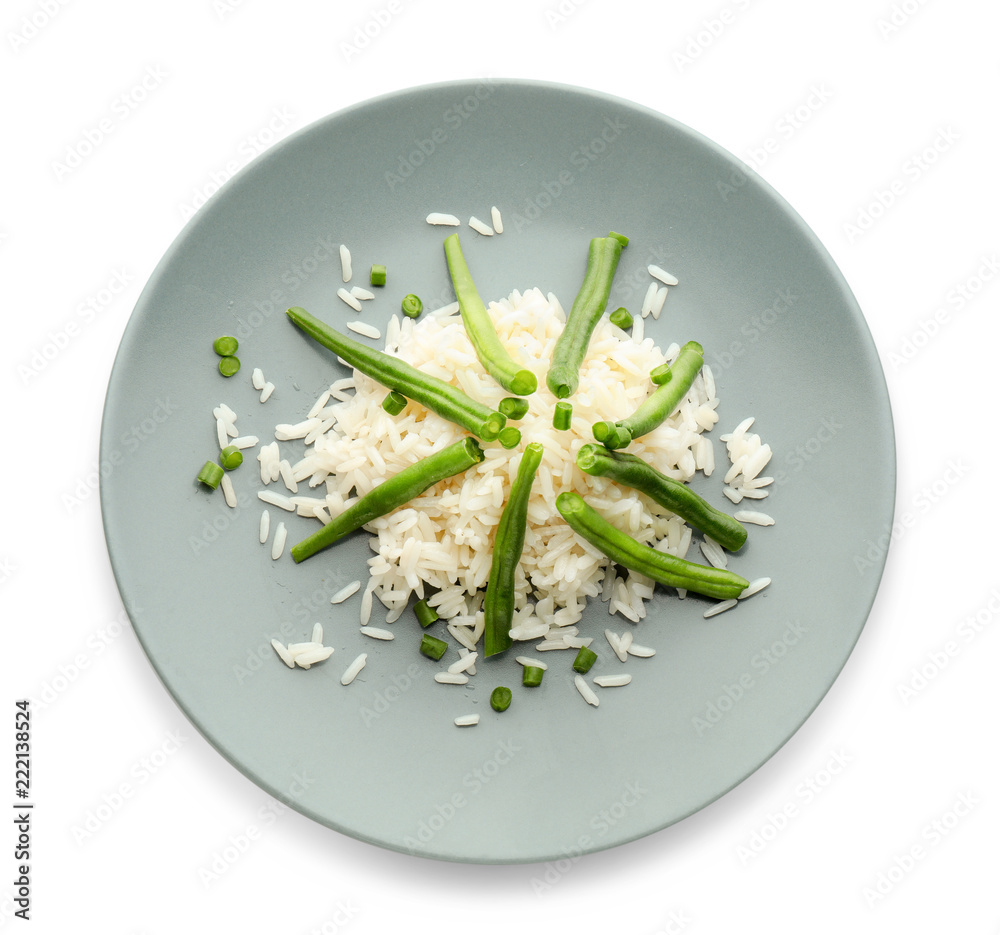 Plate with tasty boiled rice and green bean on white background