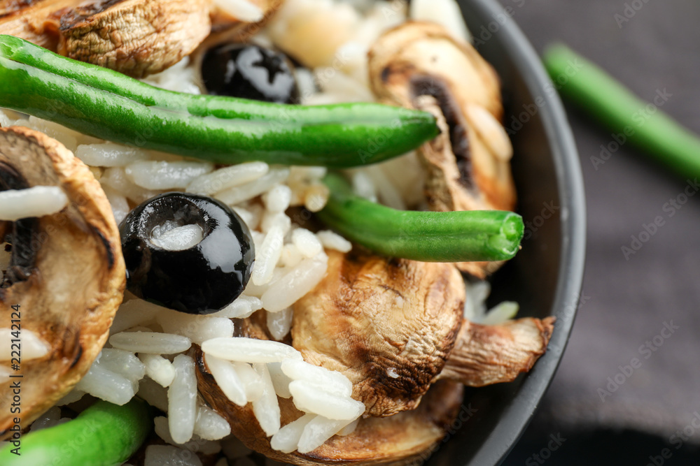 Tasty boiled rice with vegetables in bowl, closeup