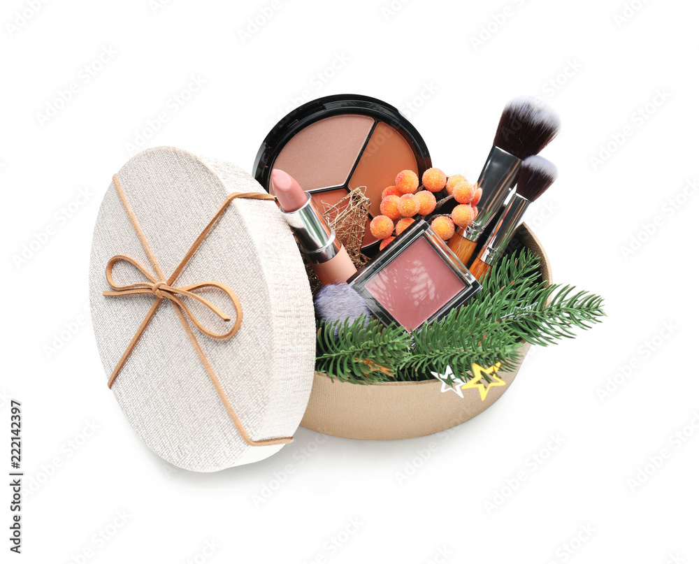 Christmas gift box with decorative cosmetics on white background