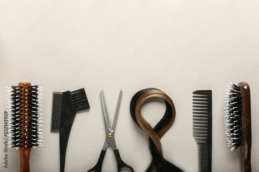 Professional hairdressers set with strands of hair on light background