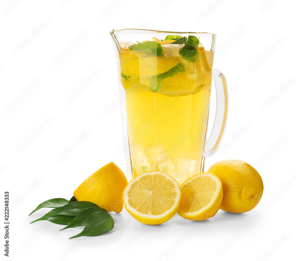 Jug of fresh lemonade on white background