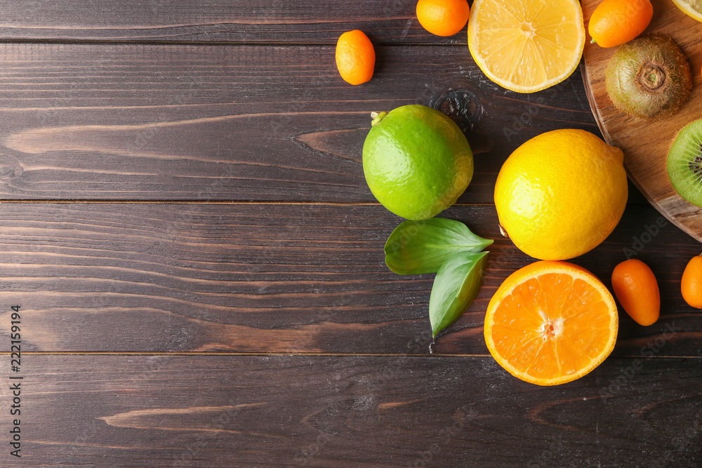 Various delicious exotic fruits on wooden background