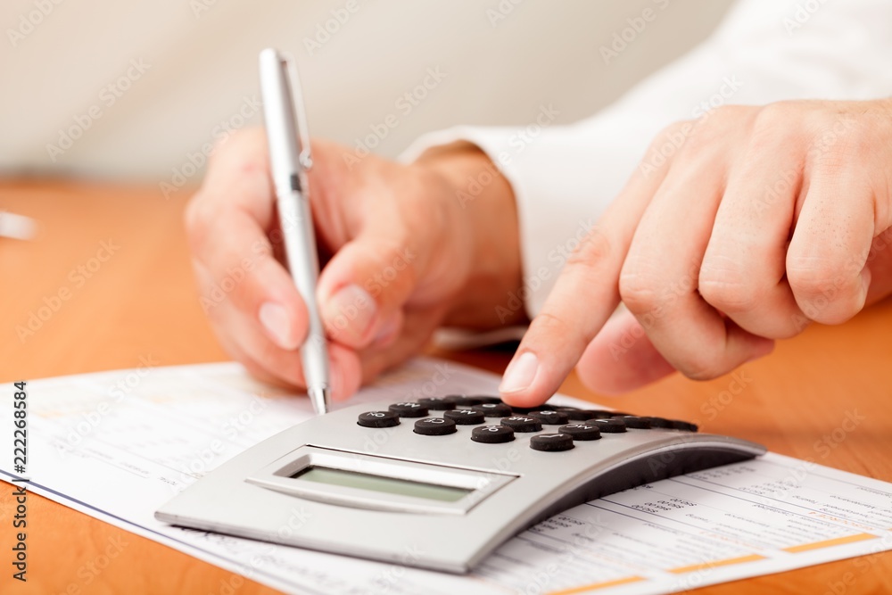 Close-up of a Businessman Analyzing Financial Figures with