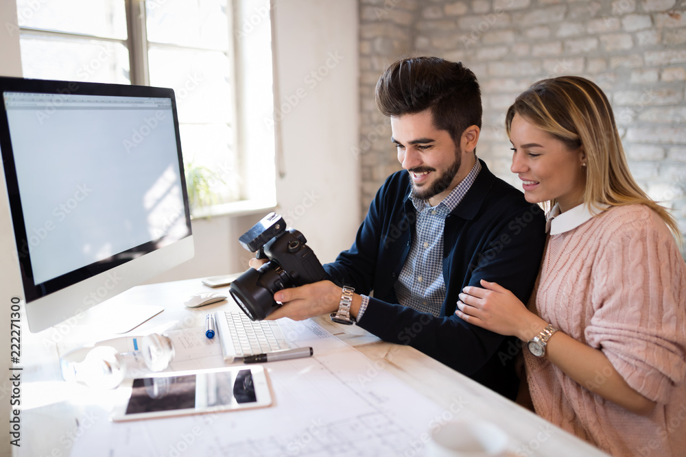 Picture of young architects discussing in office