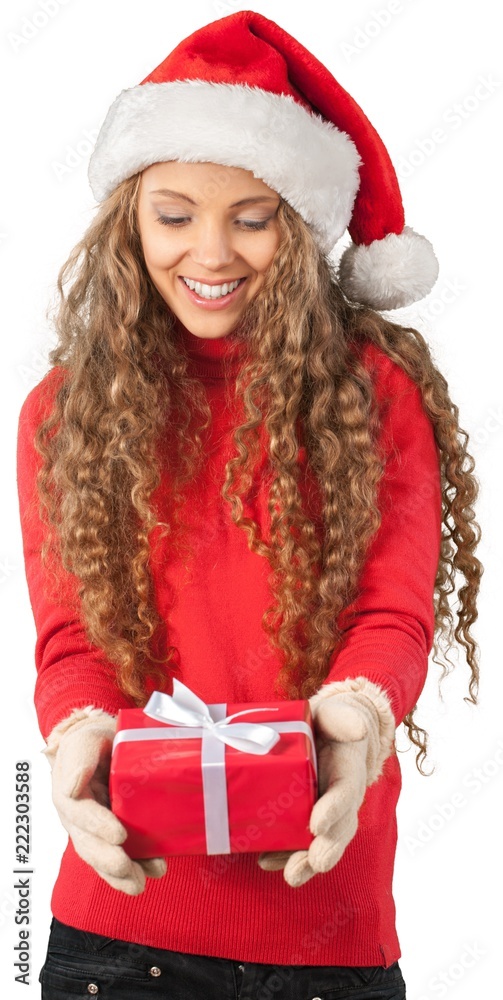 Young Woman In Santa Hat Holding Present - Isolated